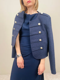 Giacca blu con bottoni dorati