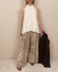 Pantalone in fantasia nei toni chiari