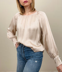 Blusa con bottone gioiello