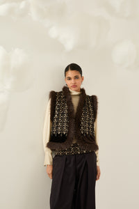 Gilet con pelo e paillettes